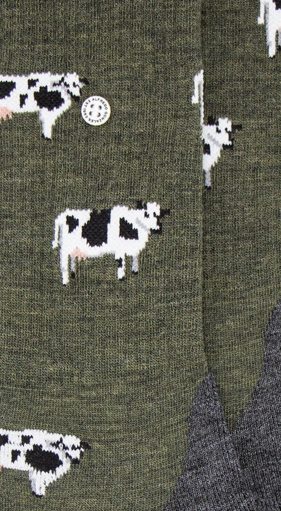 Kuh Merino Wandersocken mit Frotteesohle, bestehend aus hochwertiger Merinowolle und einzigartigem Kuhmuster.